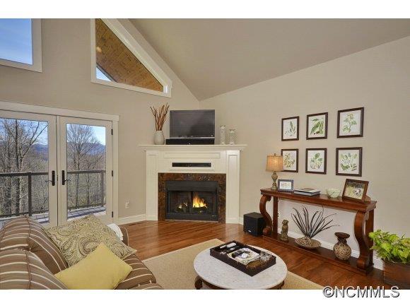 340 Porters Ridge Canton, NC 28716 - Photo 5 of 22 a living room with furniture a fireplace and a flat screen tv
