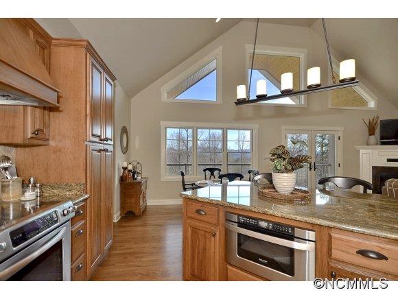340 Porters Ridge Canton, NC 28716 - Photo 8 of 22 a kitchen with stainless steel appliances granite countertop a sink a stove and cabinets