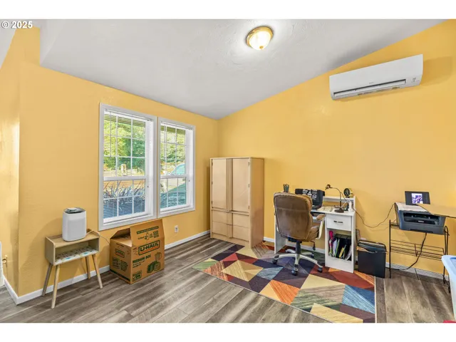 a work room with furniture and a window
