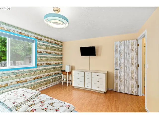 a view of kitchen with wooden floor and windows