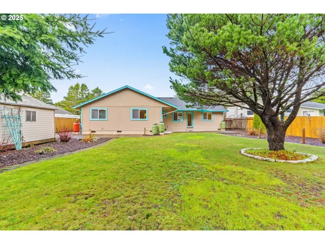a view of a yard with a house and garden