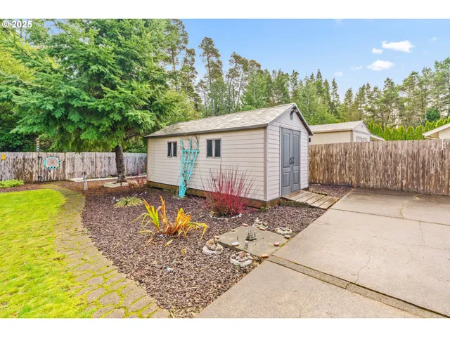 a view of a backyard with swimming pool