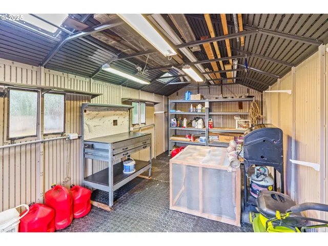 an aerial view of a house with swimming pool and garden