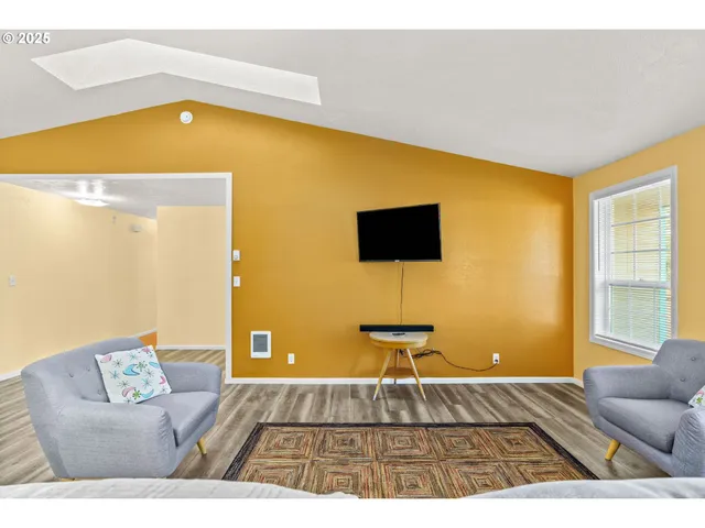 a living room with a couch and a flat screen tv