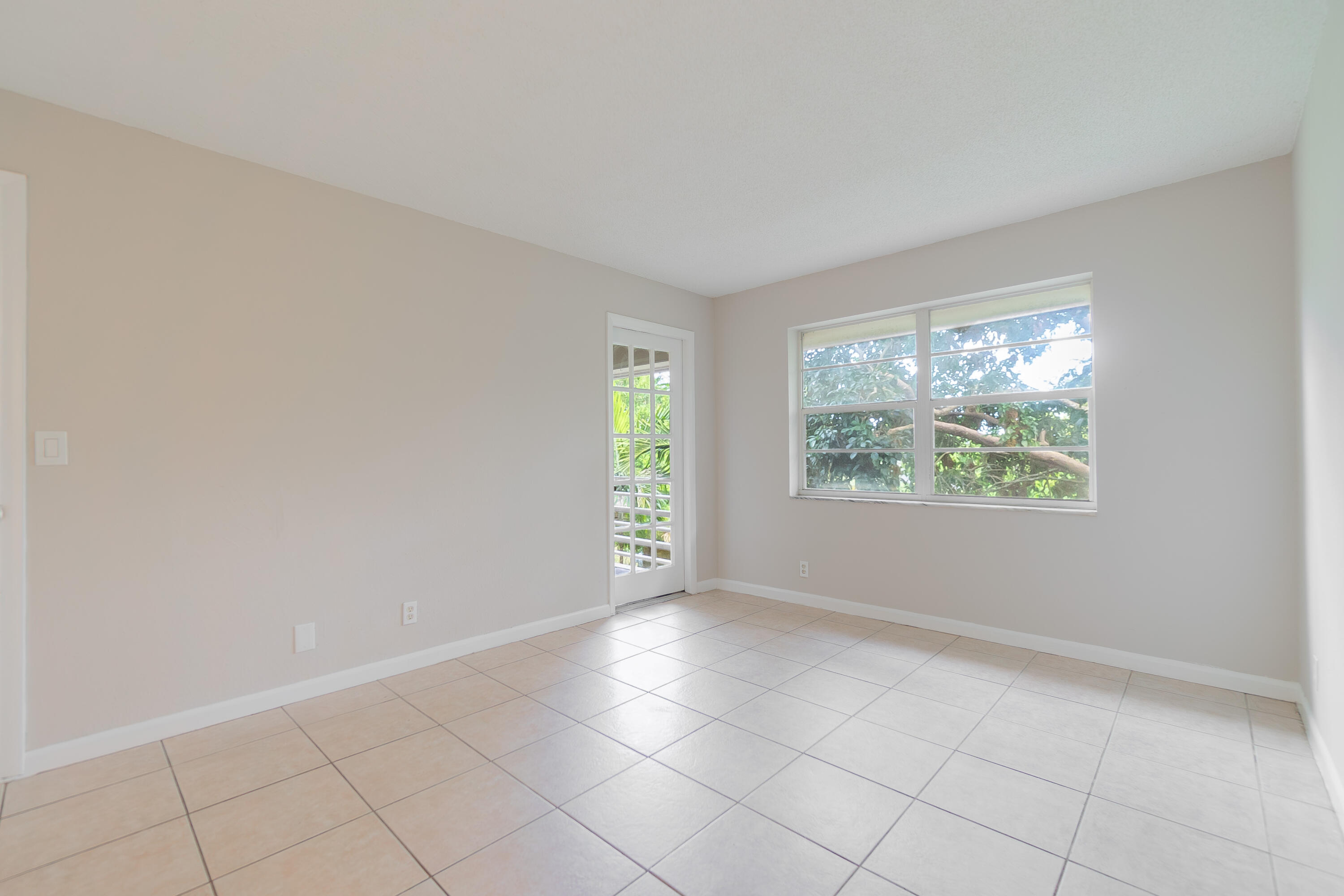 120 Sparrow Drive, Unit 314 Royal Palm Beach, FL 33411 - Photo 13 of 17 an empty room with windows