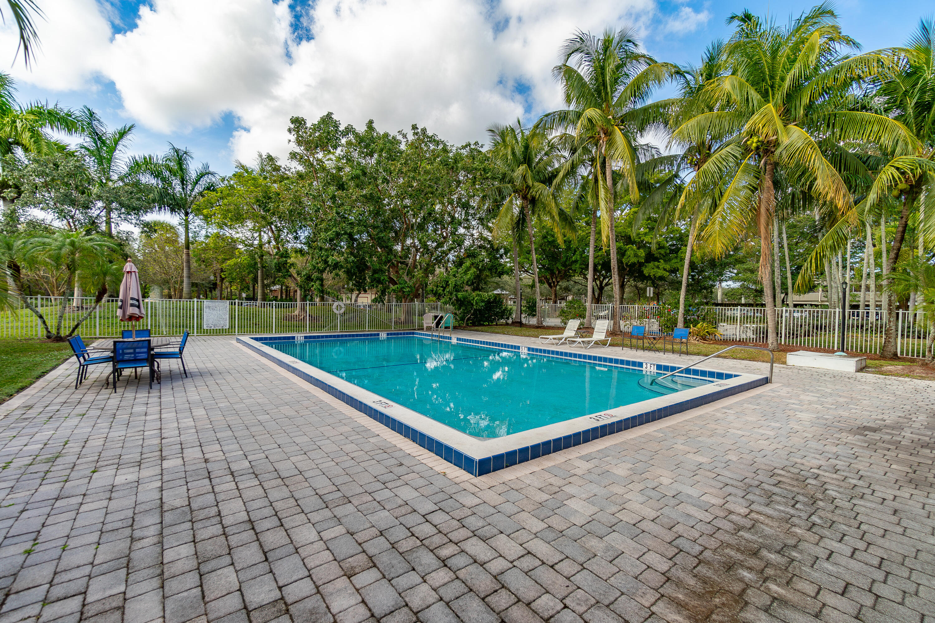 120 Sparrow Drive, Unit 314 Royal Palm Beach, FL 33411 - Photo 17 of 17 a view of a tennis court with chairs