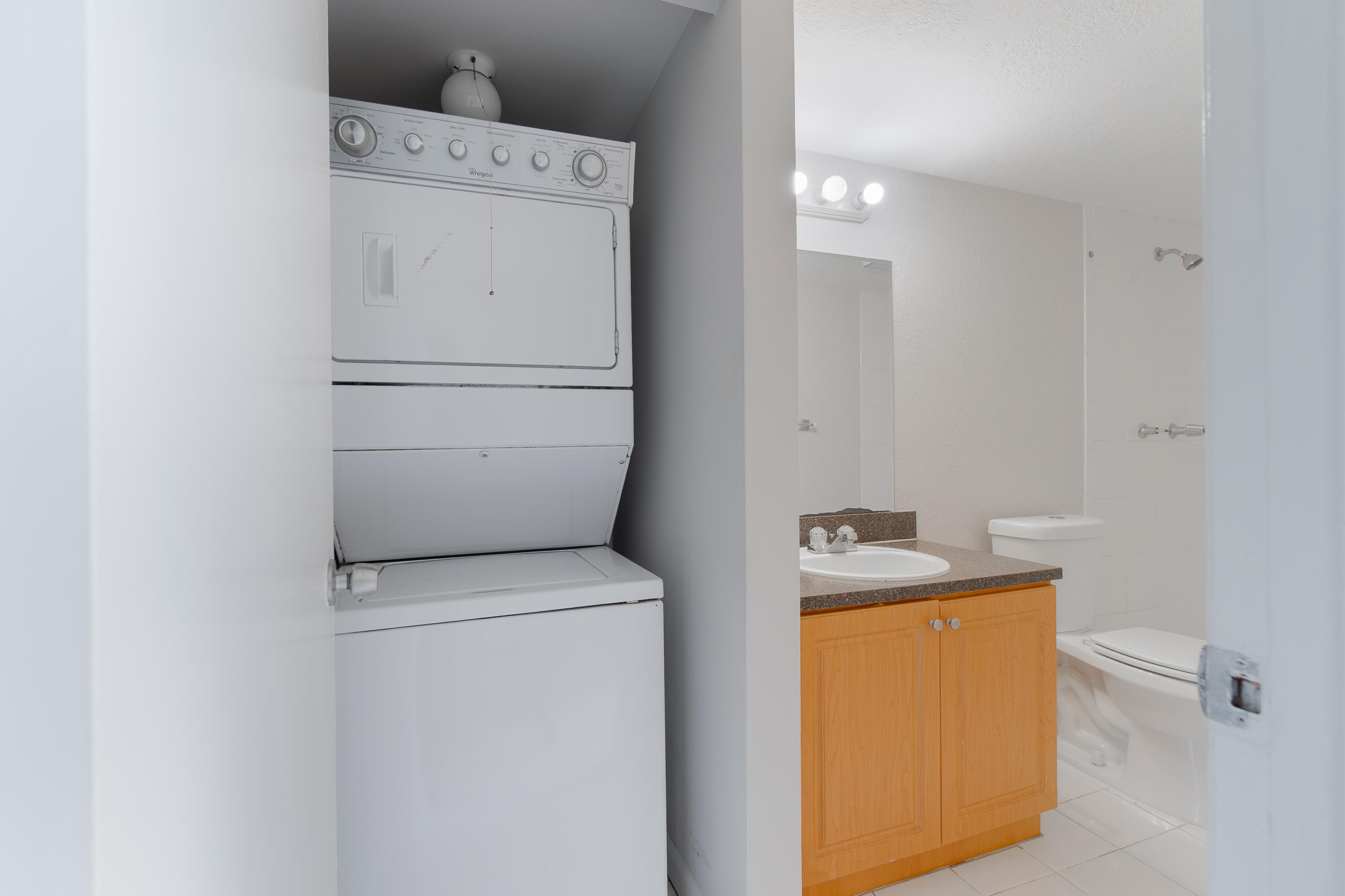 120 Sparrow Drive, Unit 314 Royal Palm Beach, FL 33411 - Photo 5 of 17 a utility room with dryer and washer