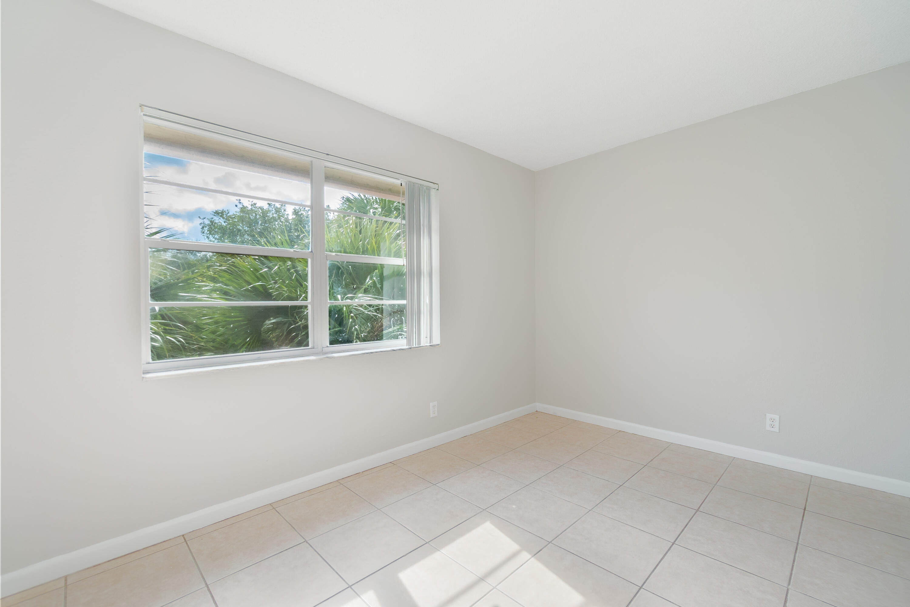 120 Sparrow Drive, Unit 314 Royal Palm Beach, FL 33411 - Photo 7 of 17 an empty room with a window