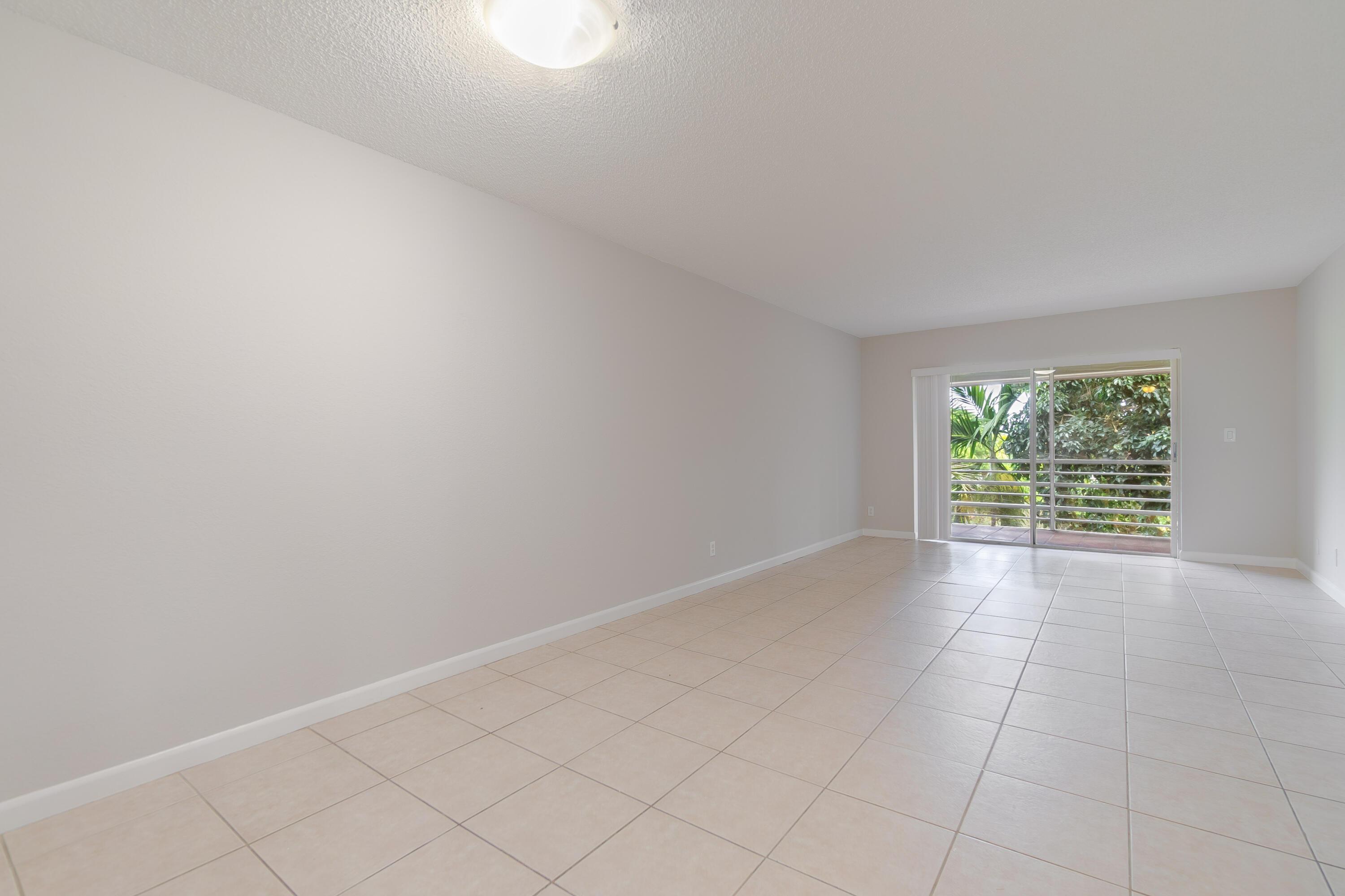 120 Sparrow Drive, Unit 314 Royal Palm Beach, FL 33411 - Photo 9 of 17 an empty room with windows
