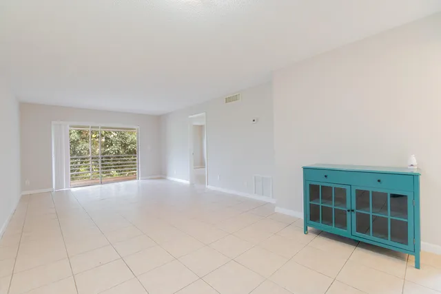 a view of empty room with windows