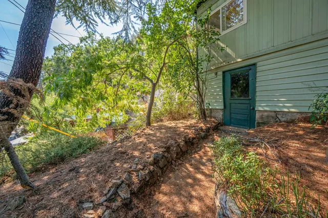 a view of a balcony with wooden floor and stairs