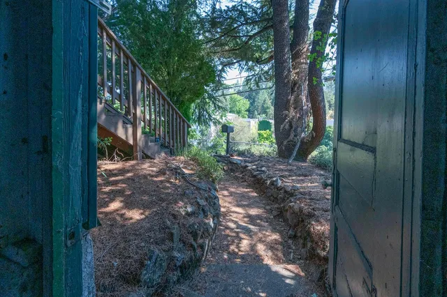a kitchen with cabinets appliances a sink and a window