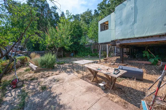an empty room with windows and cabinet
