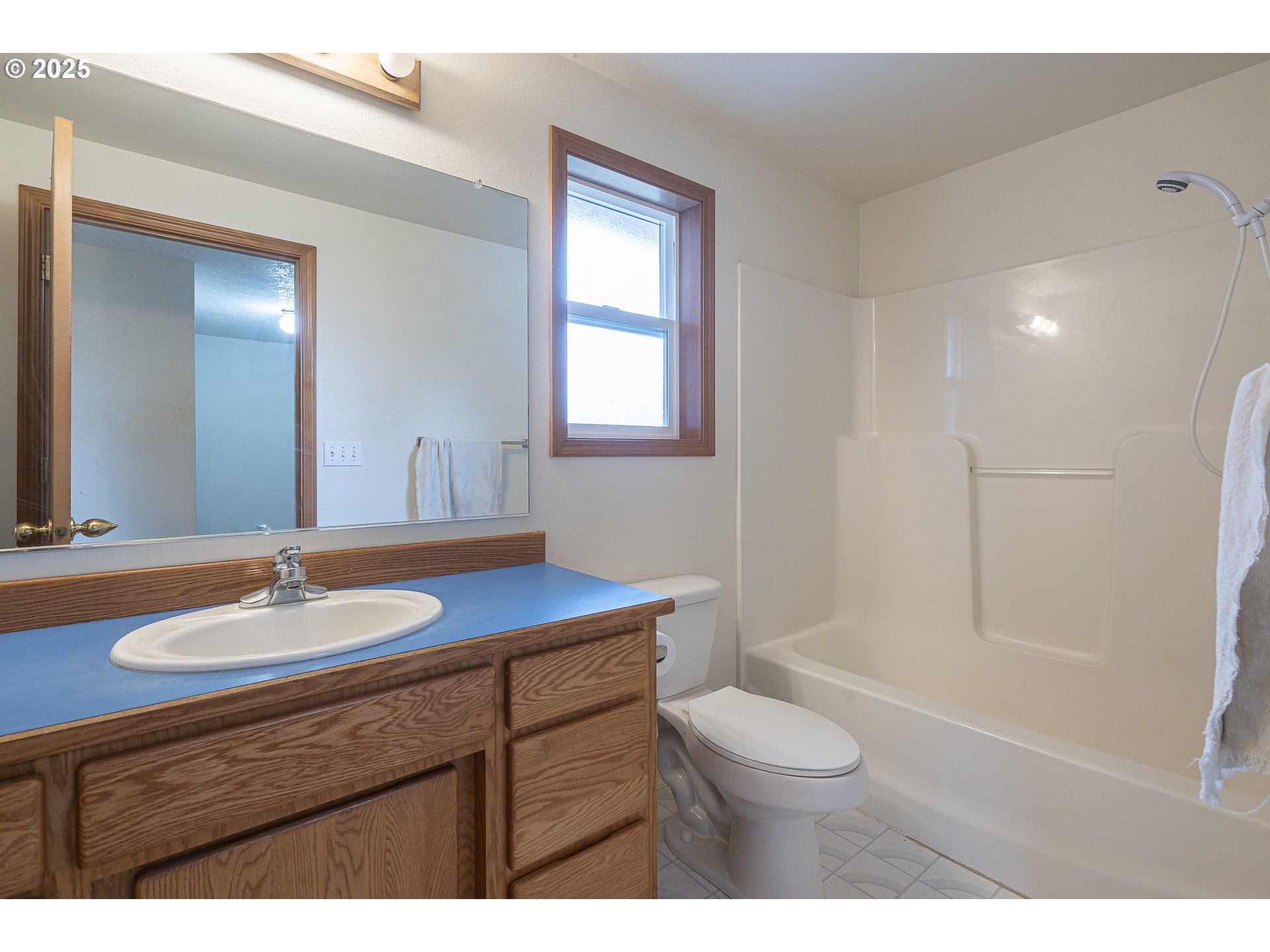 7295 Northwest Poverty Bend Road McMinnville, OR 97128 - Photo 19 of 44 a bathroom with a granite countertop sink toilet a mirror and shower