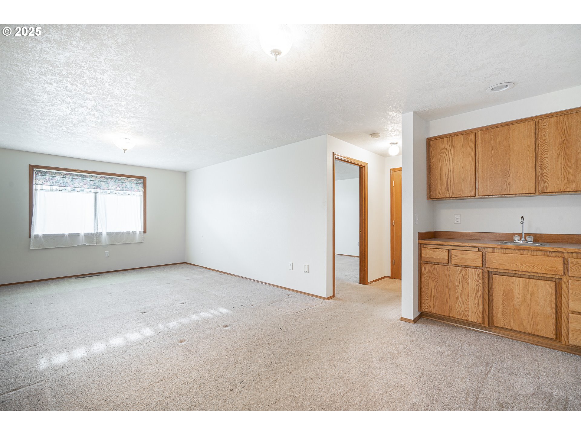 7295 Northwest Poverty Bend Road McMinnville, OR 97128 - Photo 26 of 44 a view of empty room with window and cabinet