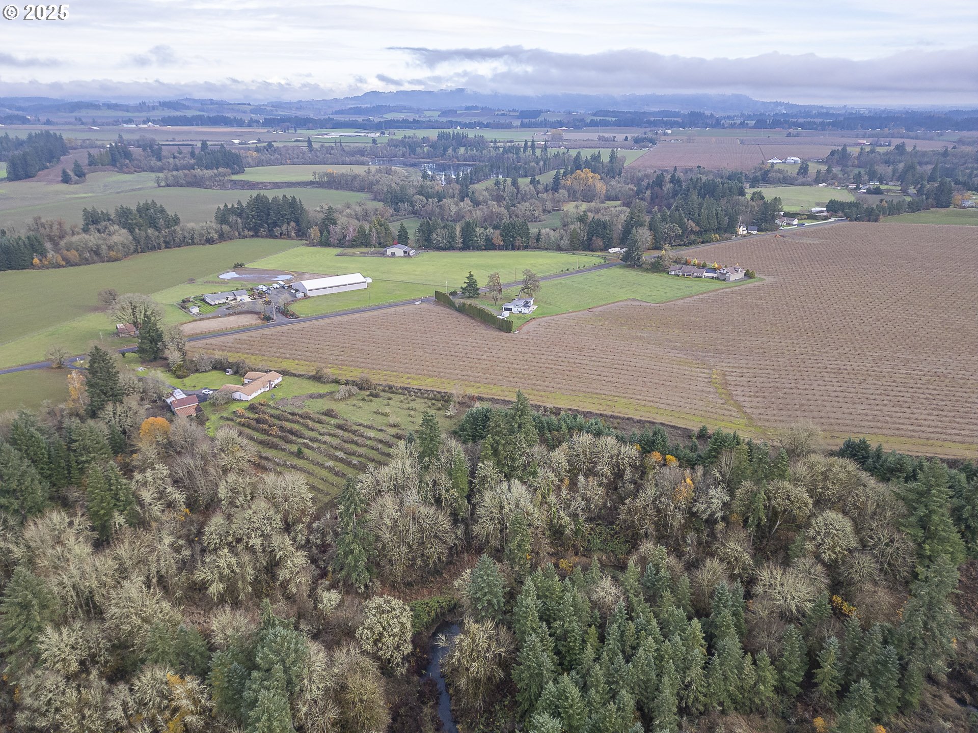 7295 Northwest Poverty Bend Road McMinnville, OR 97128 - Photo 37 of 44 an aerial view of a houses with a yard and lake view