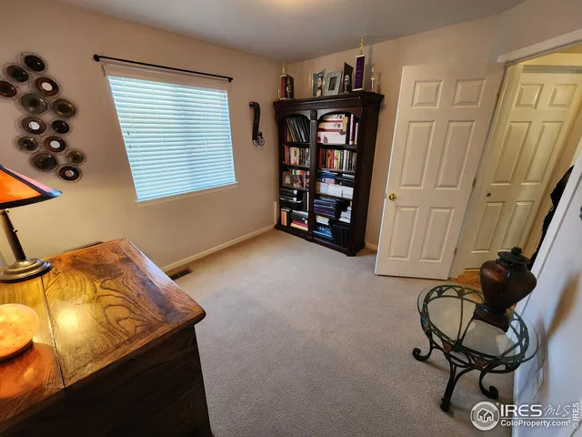 a view of room with lounge chair and windows