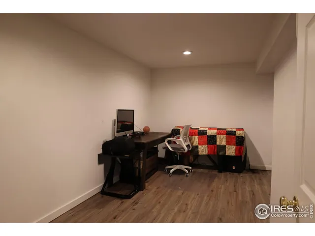a room with furniture and wooden floor