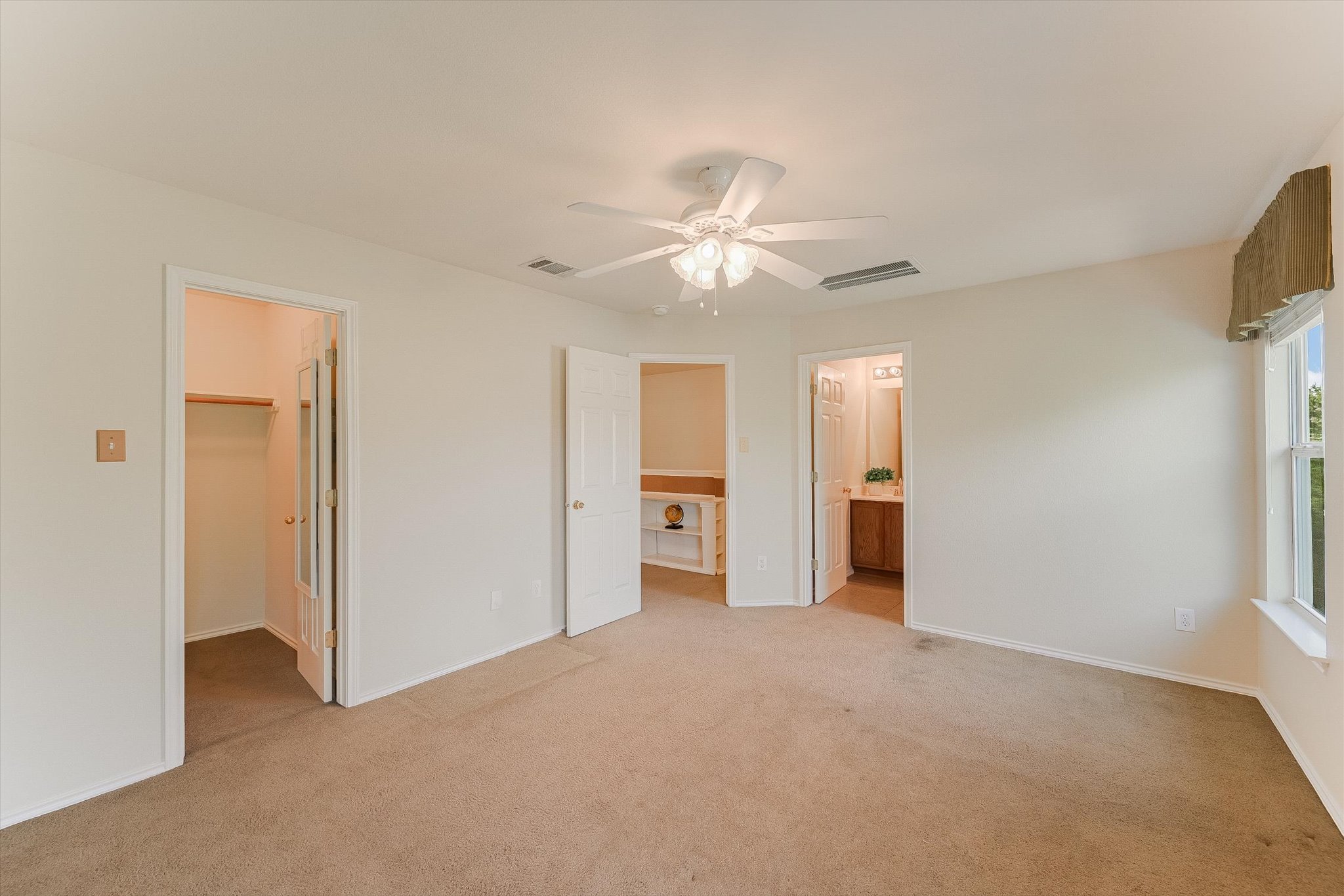 93 Verde Ranch Loop Leander, TX 78641 - Photo 11 of 20 a view of empty room with a ceiling fan and window