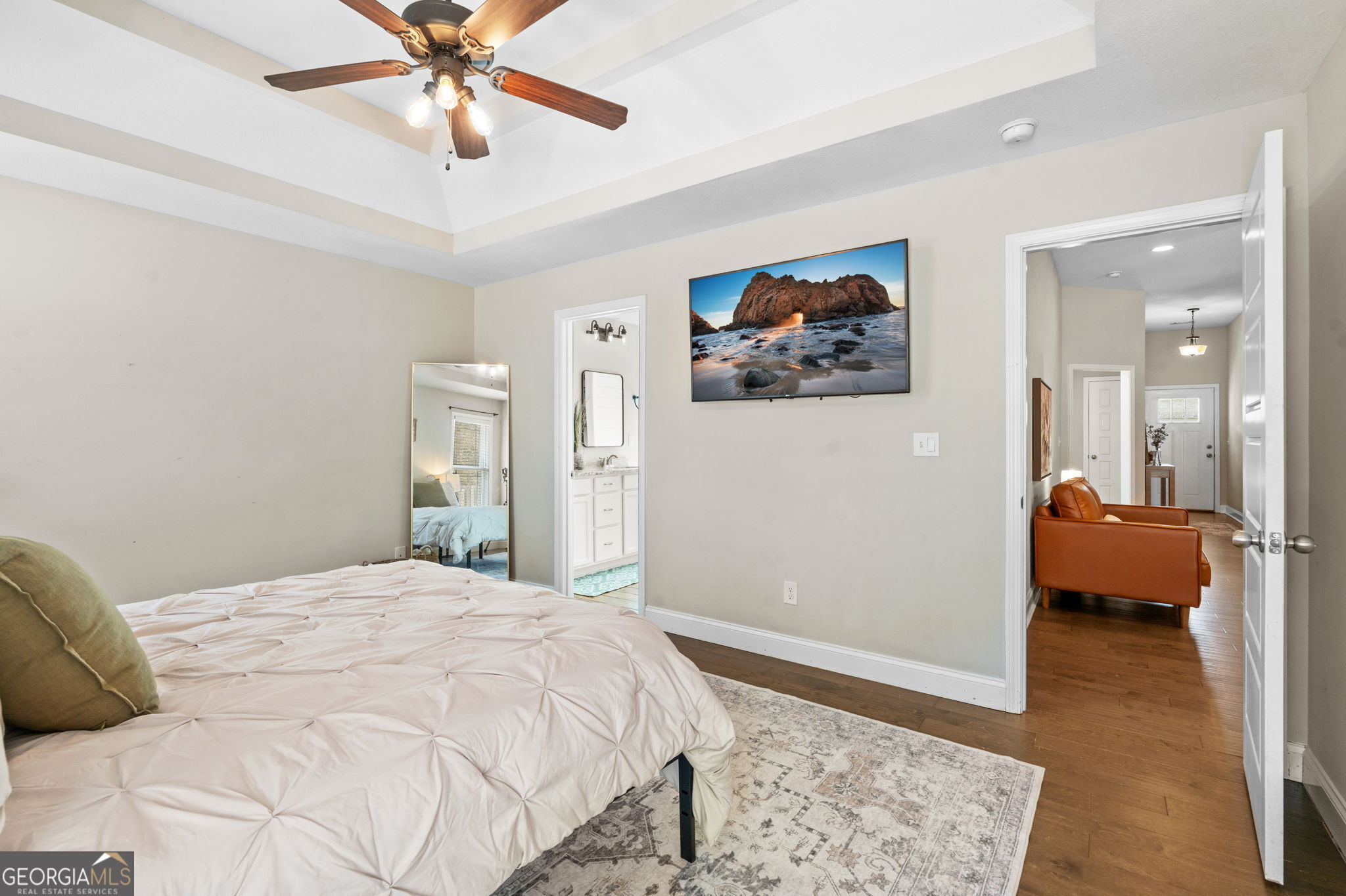 171 Hawks Rdg Trace Byron, GA 31008 - Photo 17 of 34 a bedroom with a large bed and a chandelier