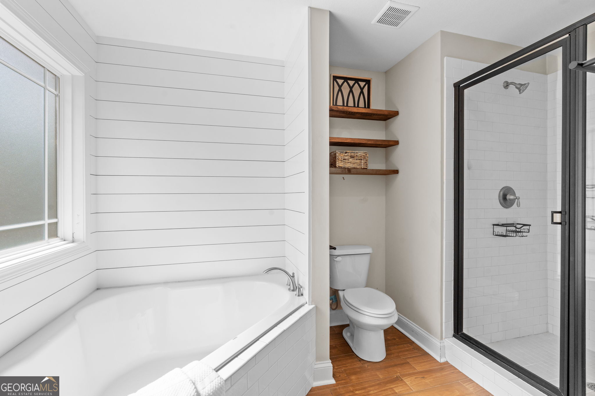 171 Hawks Rdg Trace Byron, GA 31008 - Photo 23 of 34 a bathroom with a toilet and a shower