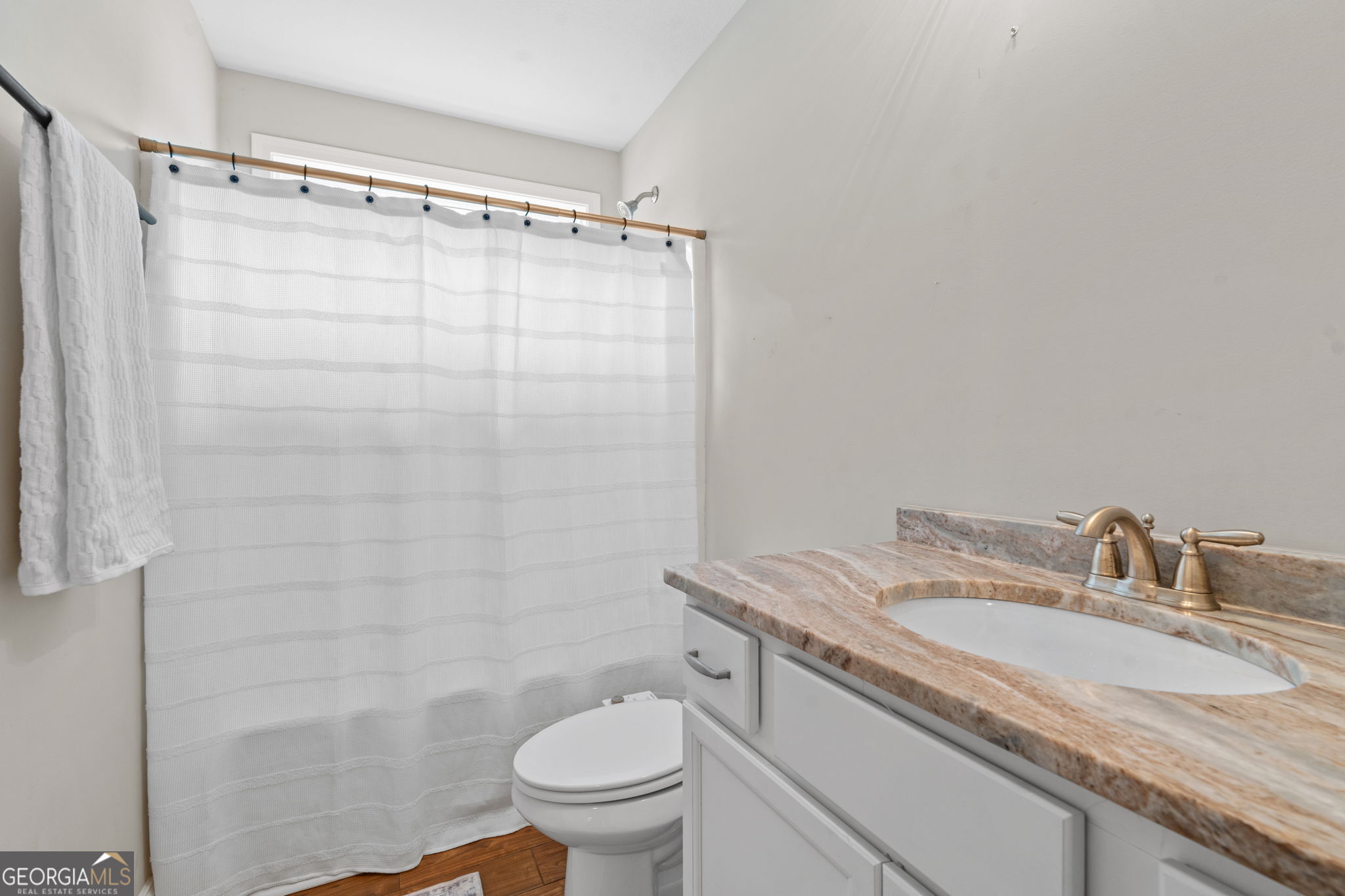 171 Hawks Rdg Trace Byron, GA 31008 - Photo 24 of 34 a bathroom with a granite countertop sink toilet and shower