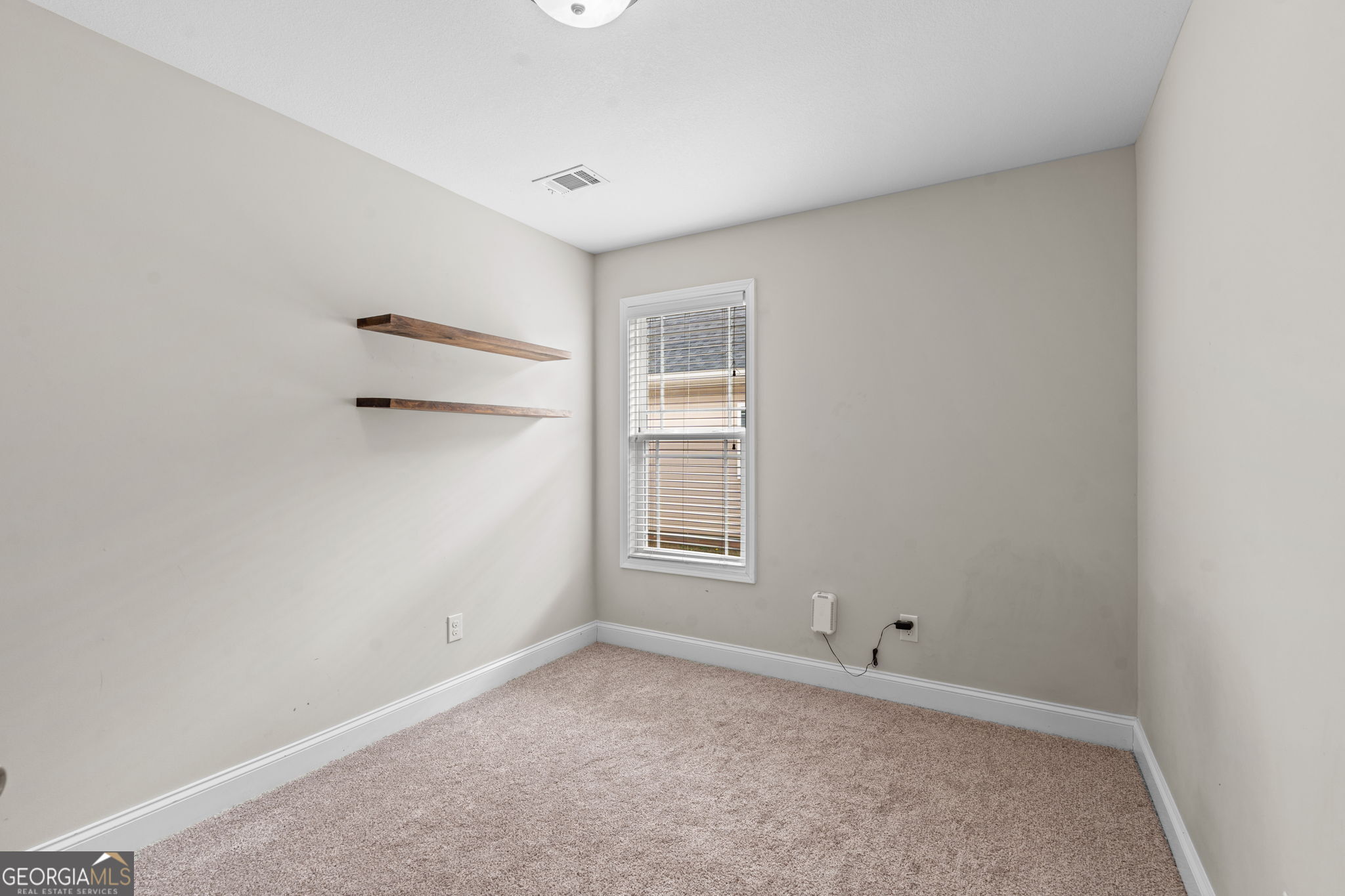 171 Hawks Rdg Trace Byron, GA 31008 - Photo 29 of 34 a view of empty room with windows