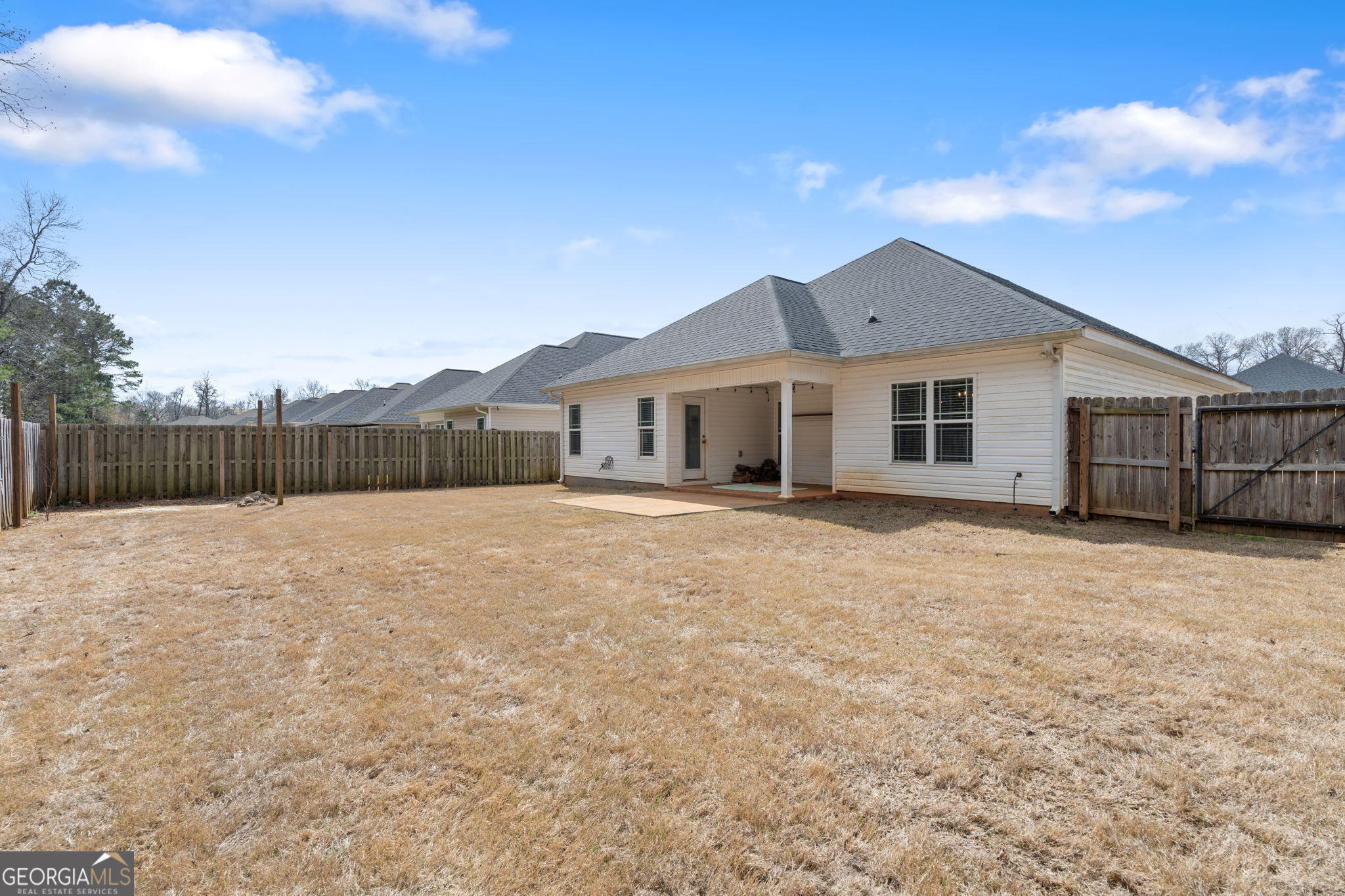 171 Hawks Rdg Trace Byron, GA 31008 - Photo 33 of 34 a view of a house with a backyard