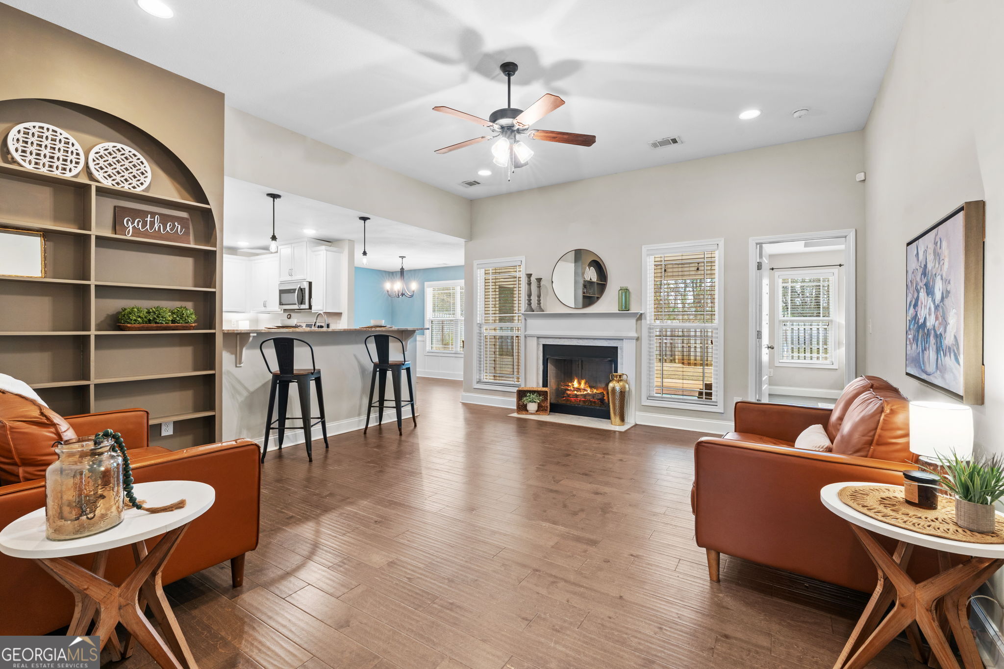 171 Hawks Rdg Trace Byron, GA 31008 - Photo 5 of 34 a living room with furniture a fireplace and a flat screen tv