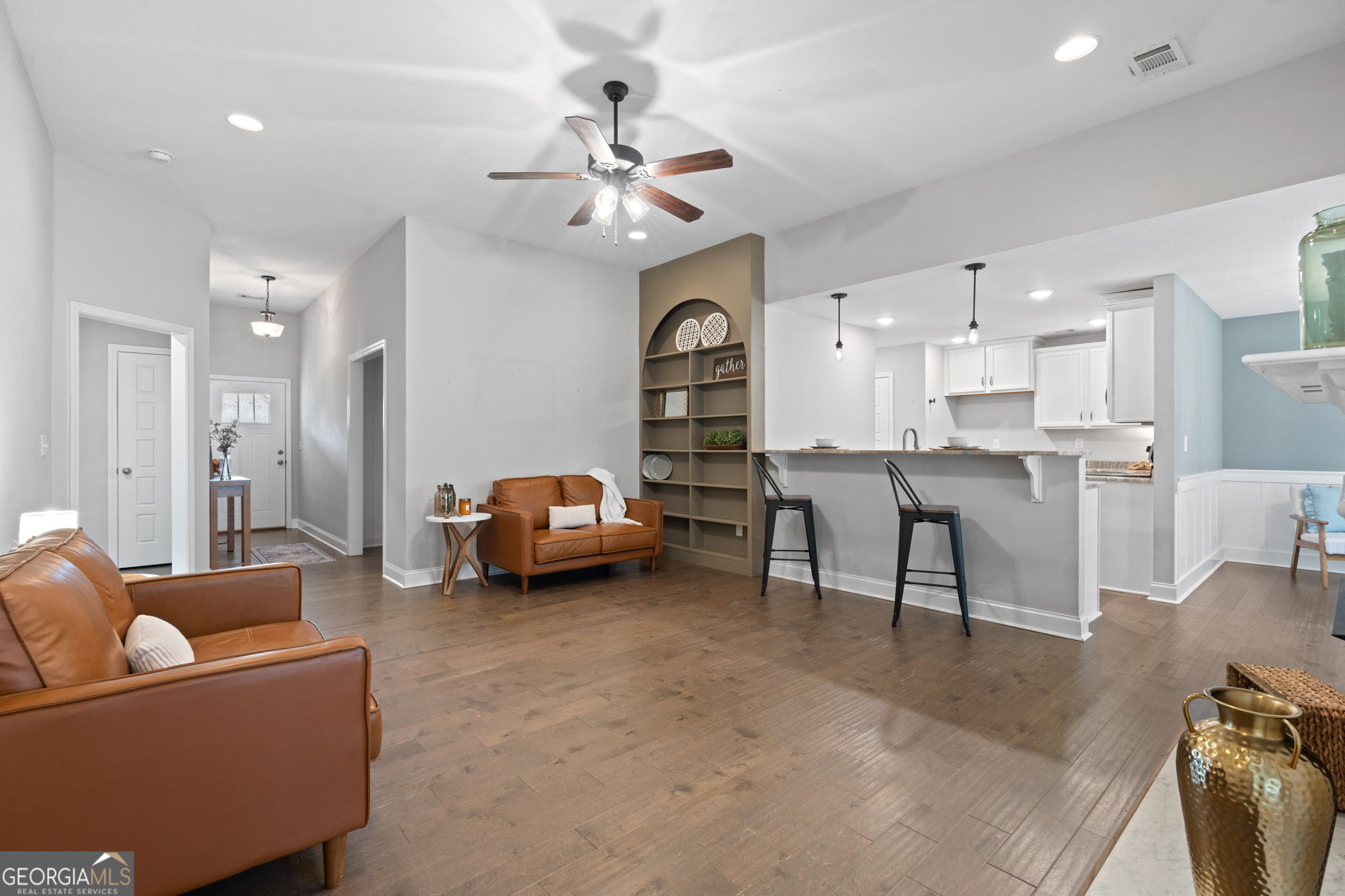 171 Hawks Rdg Trace Byron, GA 31008 - Photo 6 of 34 a living room with furniture and kitchen view