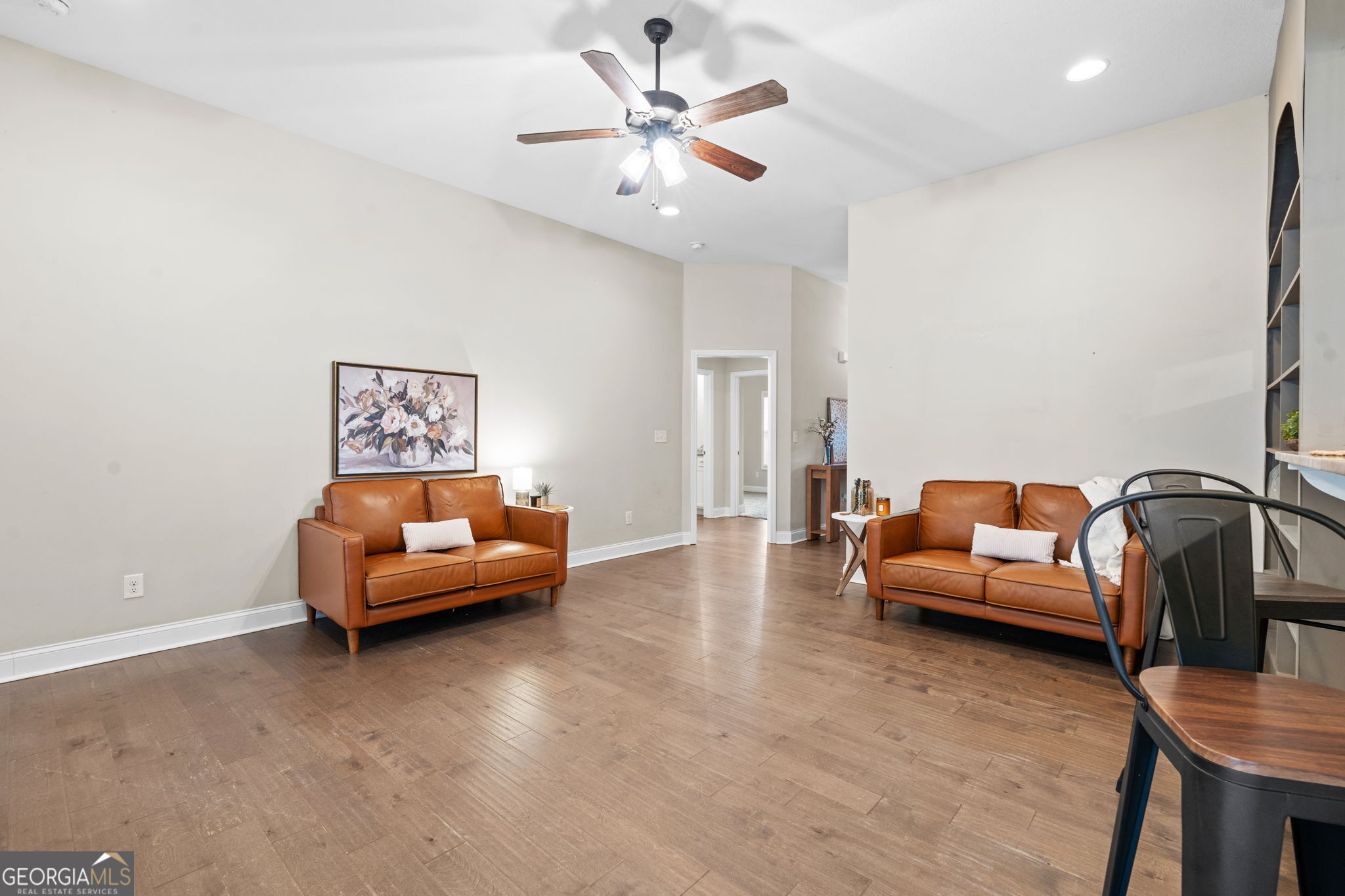 171 Hawks Rdg Trace Byron, GA 31008 - Photo 7 of 34 a living room with furniture and a chandelier