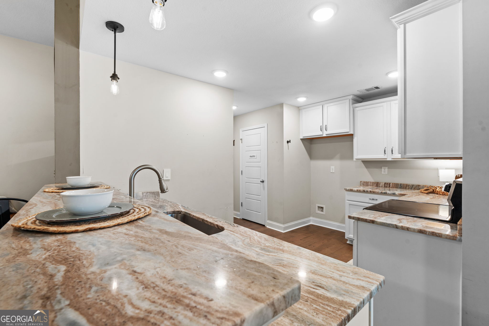 171 Hawks Rdg Trace Byron, GA 31008 - Photo 9 of 34 a kitchen with stainless steel appliances granite countertop a sink a stove and a refrigerator