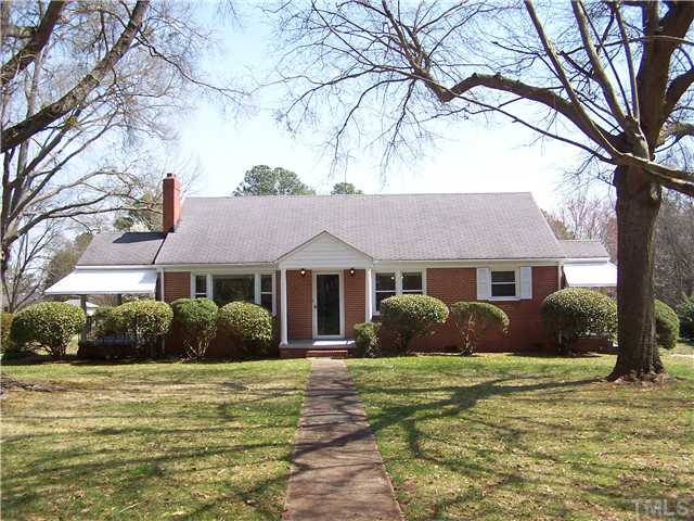 108 Lord Berkley Road Raleigh, NC 27610 - Photo 1 of 24 a front view of a house with a garden