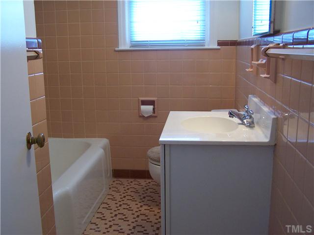 108 Lord Berkley Road Raleigh, NC 27610 - Photo 12 of 24 a bathroom with a sink a toilet and shower