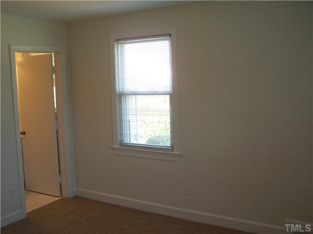 108 Lord Berkley Road Raleigh, NC 27610 - Photo 14 of 24 an empty room with a window