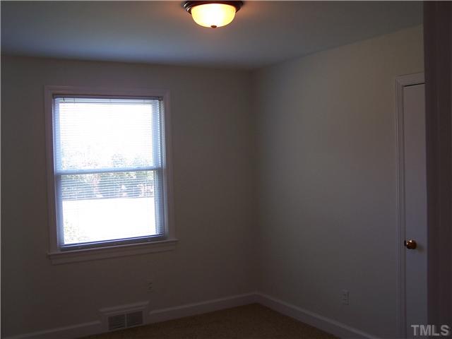 108 Lord Berkley Road Raleigh, NC 27610 - Photo 15 of 24 an empty room with a window