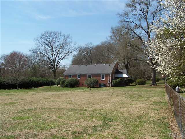108 Lord Berkley Road Raleigh, NC 27610 - Photo 18 of 24 a view of a house with a yard