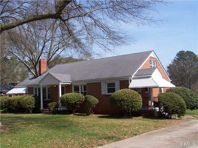 108 Lord Berkley Road Raleigh, NC 27610 - Photo 2 of 24 a front view of a house with a yard and garage