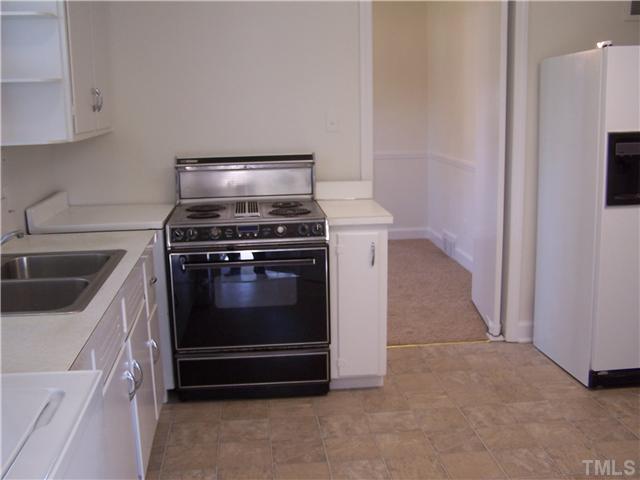 108 Lord Berkley Road Raleigh, NC 27610 - Photo 10 of 24 a stove top oven sitting inside of a kitchen