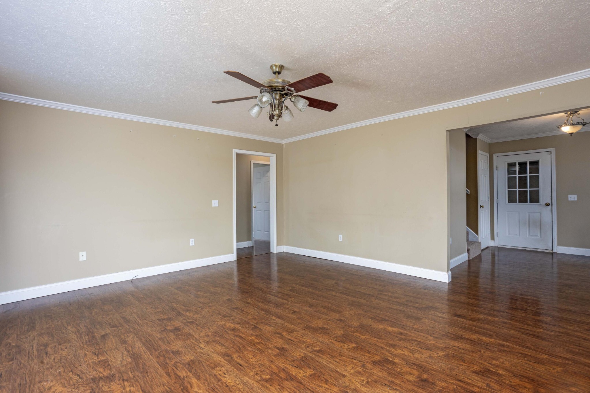 1165 Possum Trot Road Grandview, TN 37337 - Photo 13 of 48 a view of an empty room with window and wooden floor