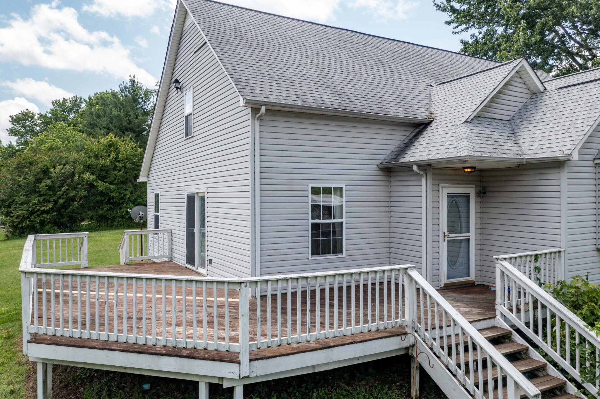 1165 Possum Trot Road Grandview, TN 37337 - Photo 2 of 48 a view of a deck with a chair