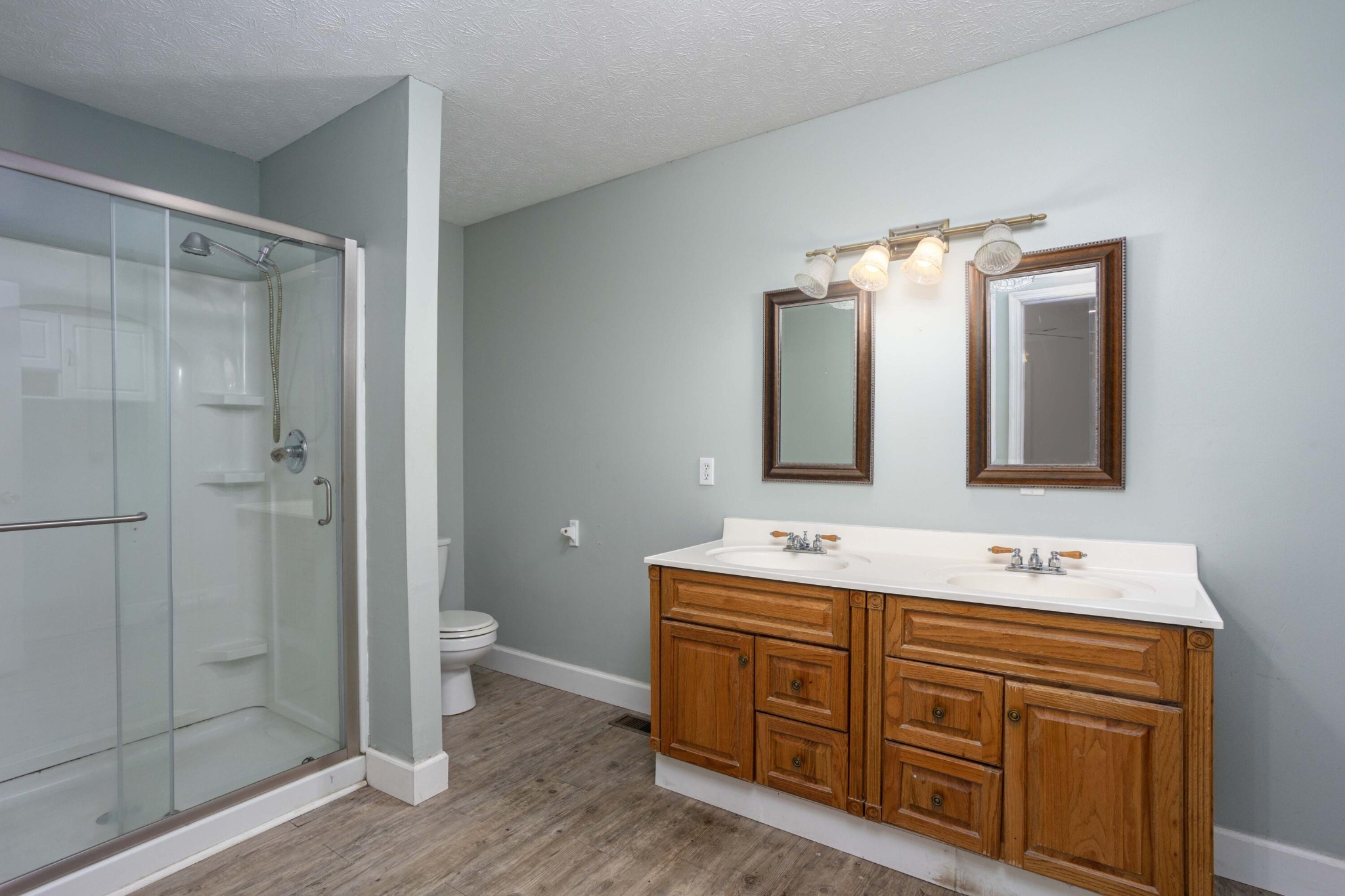 1165 Possum Trot Road Grandview, TN 37337 - Photo 23 of 48 a bathroom with a double vanity sink mirror and toilet