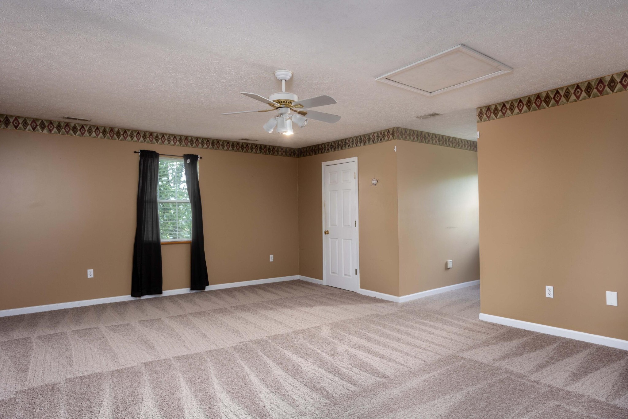 1165 Possum Trot Road Grandview, TN 37337 - Photo 27 of 48 a view of an empty room with a window