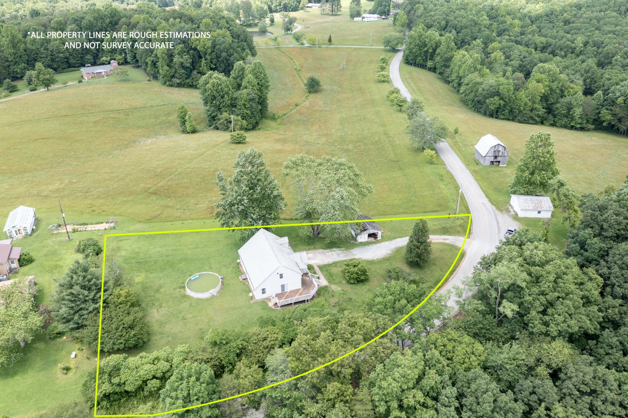 1165 Possum Trot Road Grandview, TN 37337 - Photo 4 of 48 a view of a lake with a building in the background