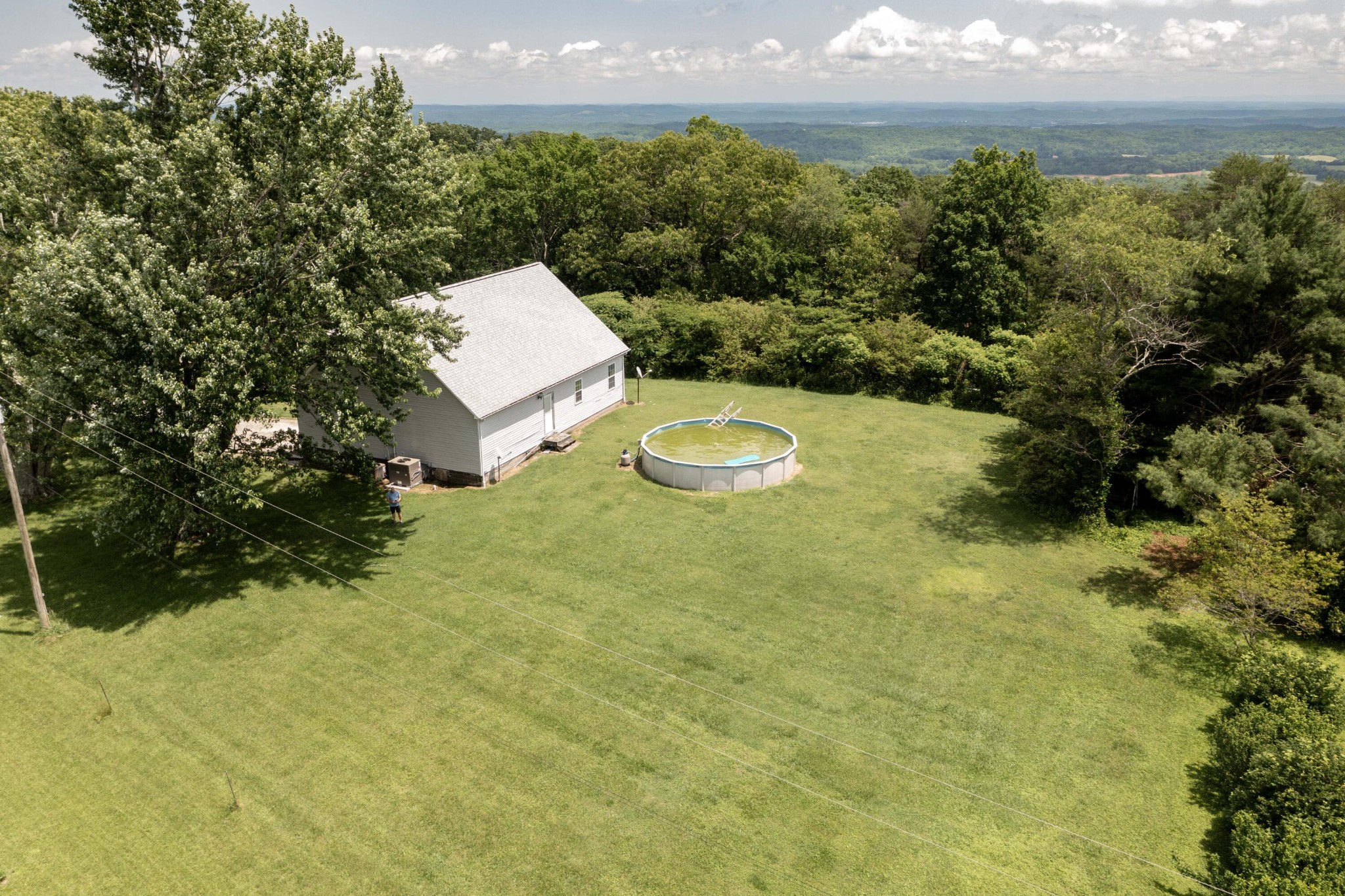 1165 Possum Trot Road Grandview, TN 37337 - Photo 41 of 48 a view of a big yard with an outdoor space and seating