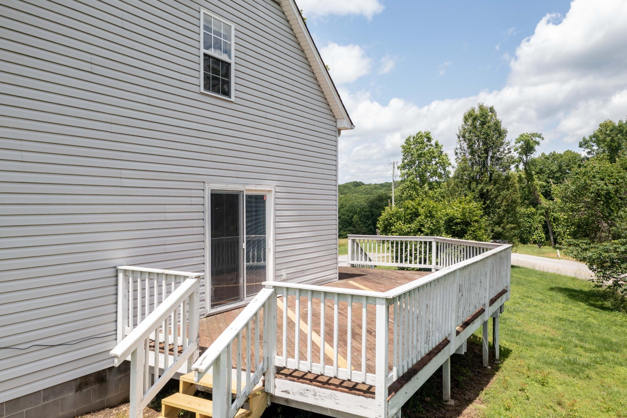 1165 Possum Trot Road Grandview, TN 37337 - Photo 43 of 48 a view of a balcony with wooden floor and fence