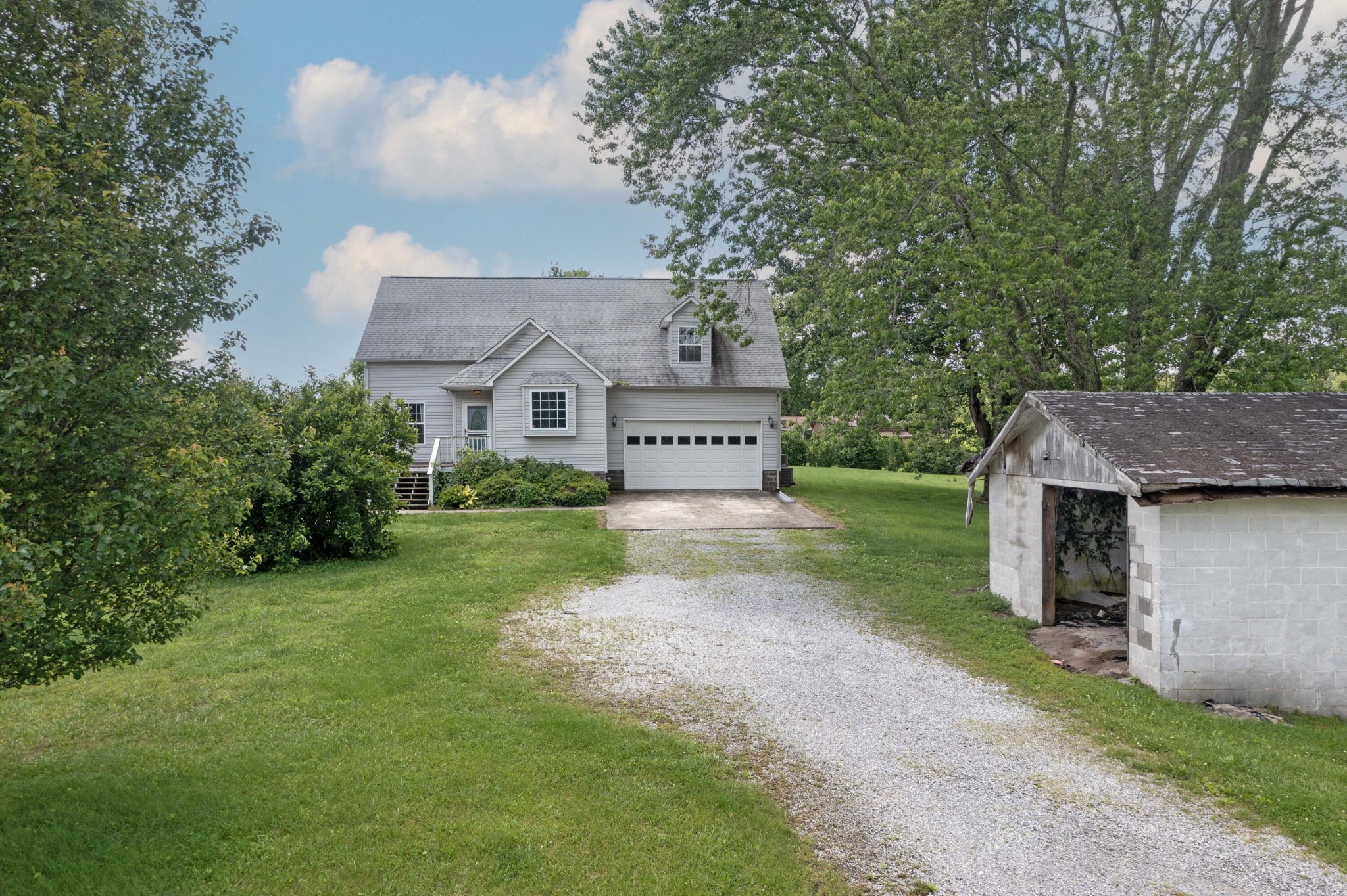 1165 Possum Trot Road Grandview, TN 37337 - Photo 7 of 48 a view of a house with a yard and large tree