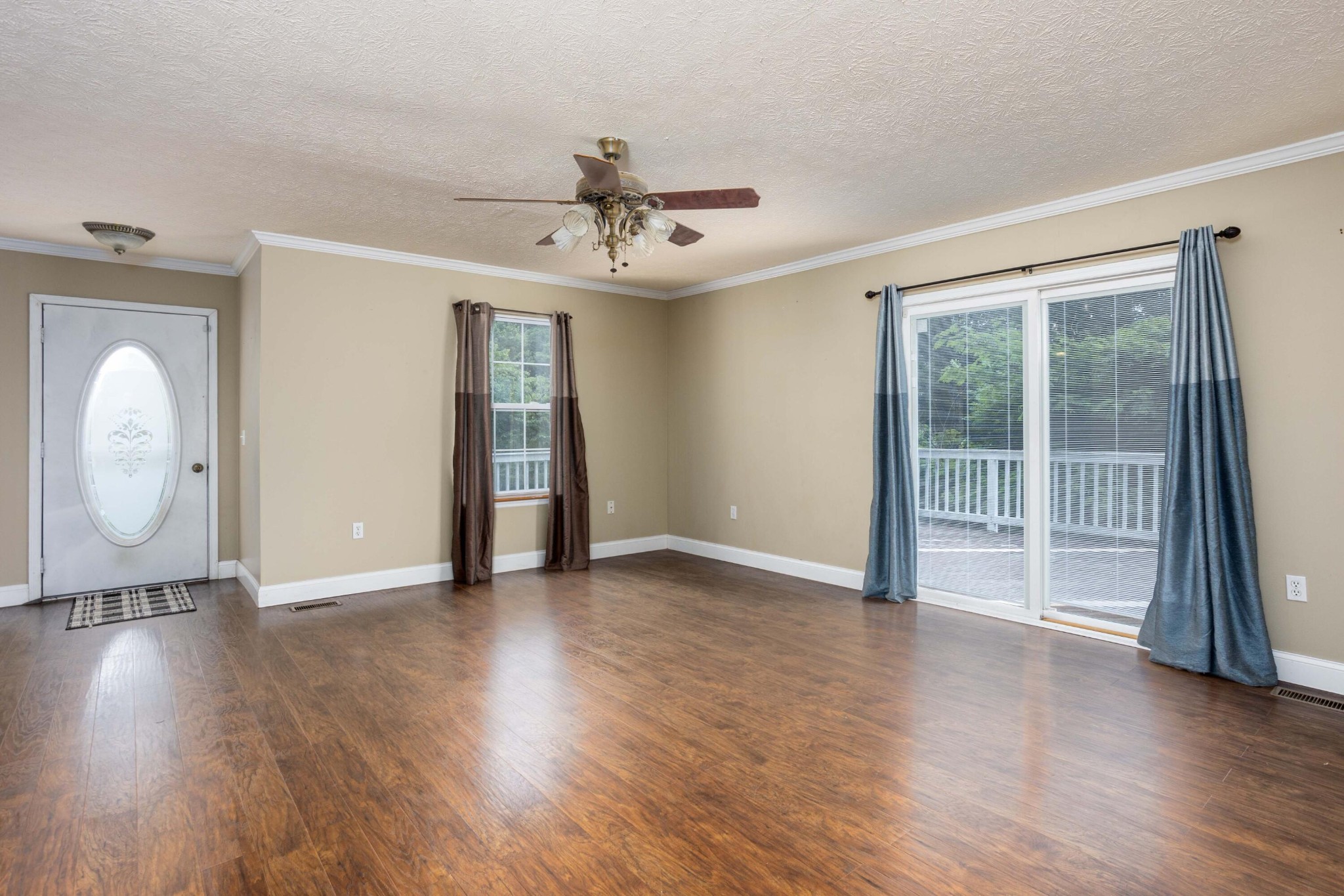 1165 Possum Trot Road Grandview, TN 37337 - Photo 10 of 48 a view of an empty room with a window and wooden floor