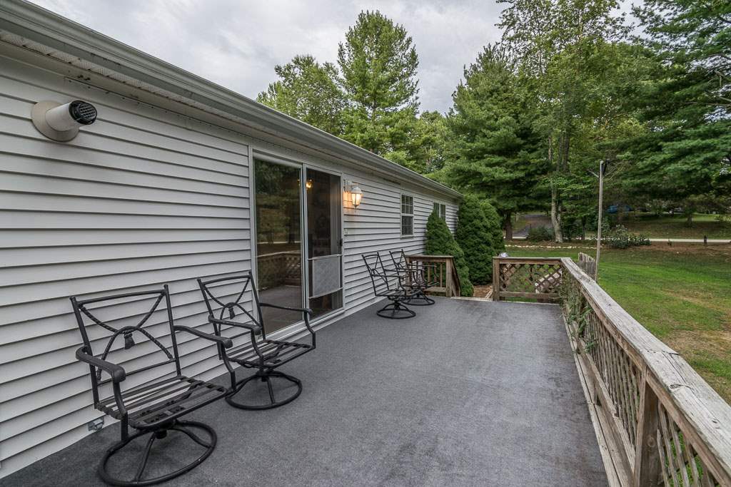 325 Steeles Fort Road Raphine, VA 24472 - Photo 17 of 50 a backyard of a house with barbeque oven table and chairs