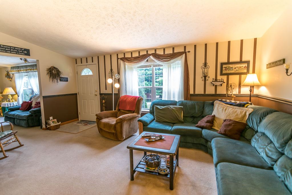 325 Steeles Fort Road Raphine, VA 24472 - Photo 21 of 50 a living room with furniture and a large window